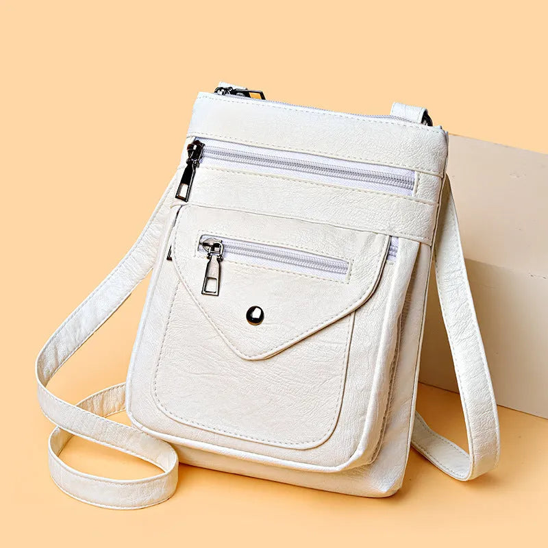 Women's vertical crossbody mobile phone bag in PU material with shoulder strap