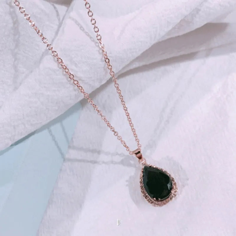 Women's alloy drop necklace with geometric rhinestone pattern in pink rose gold colour