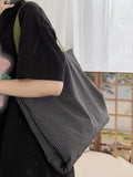 Canvas multi-layer tote shoulder bag showing three colour options: light pink stripes, black and gray plaid, dark gray stripes