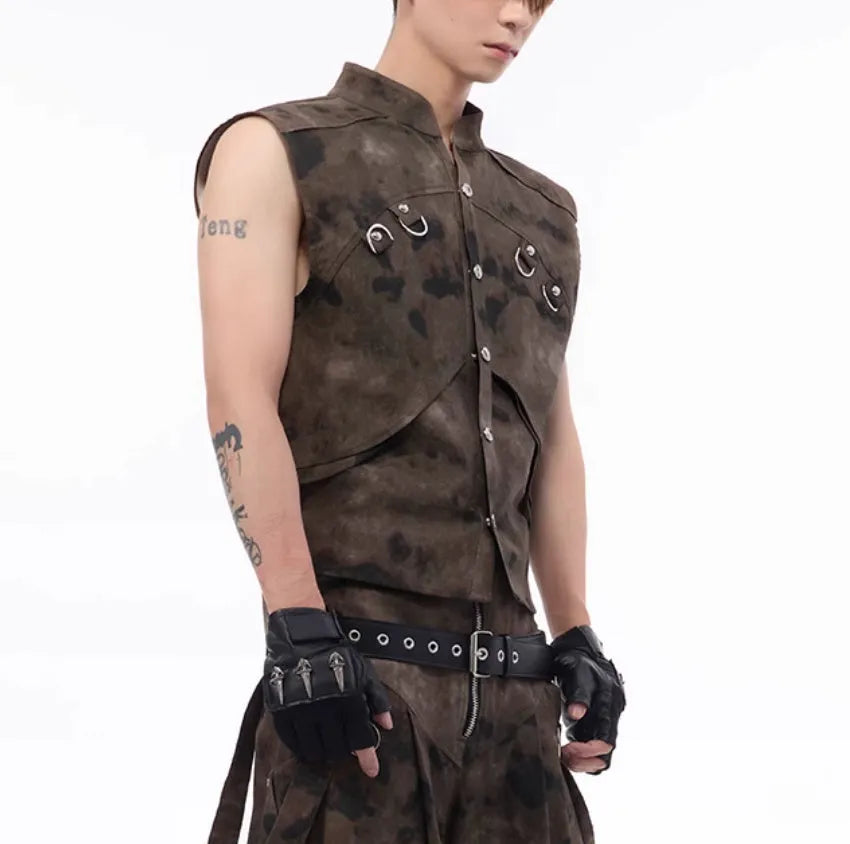 Camouflage pattern denim vest and matching trousers laid flat, showing button front and semi-high collar.