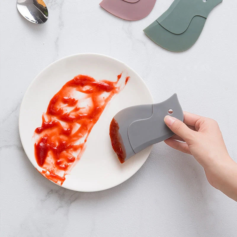 Penguin-shaped kitchen scraper for efficient plate and pot cleaning
