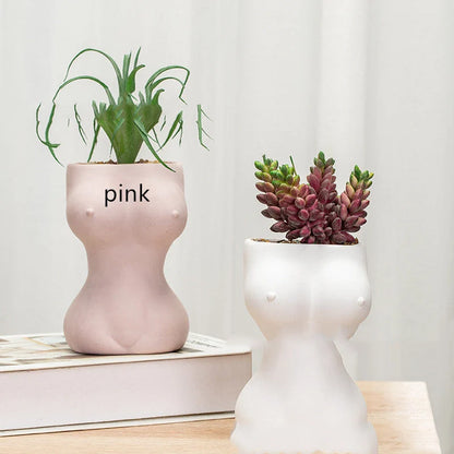 European style ceramic flower pots with decorative figures and gods in white, pink, and brown