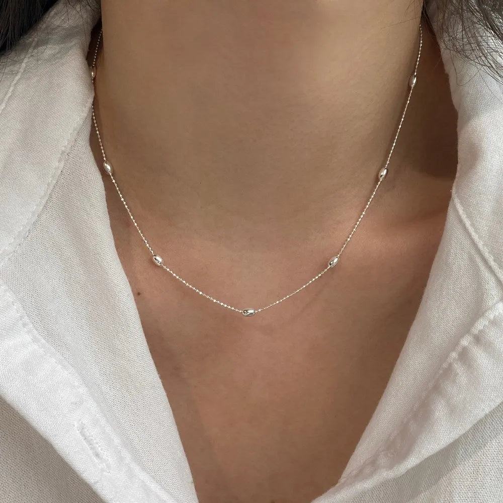 Women's 925 silver oval bead clavicle chain, simple electroplated finish, silver colour necklace on display
