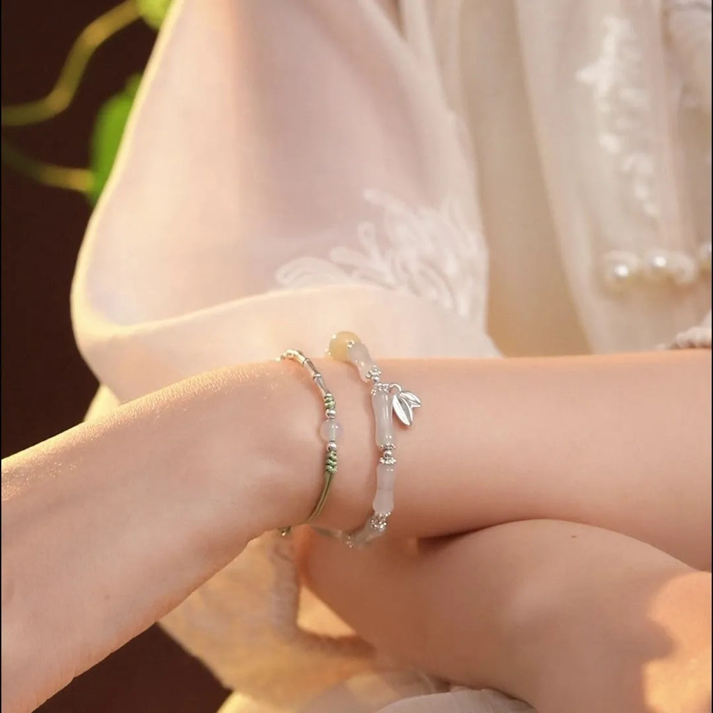 Women's antique-style bracelet made from Tianshan green bamboo and sterling silver with bamboo joint detailing.