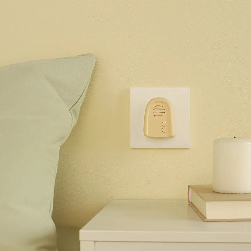 Wireless plug-in self-generating doorbell in milky yellow or white colour for household signalling