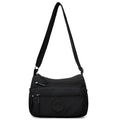 Grey water-repellent nylon crossbody bag showing three-dimensional pockets and a single shoulder strap.