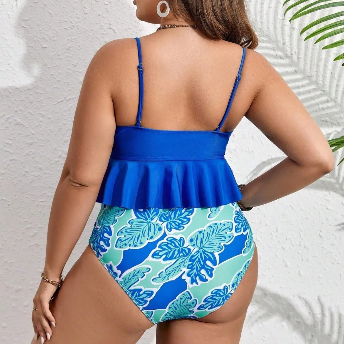 Blue bikini top and shorts set on a mannequin, showing European and American fit.