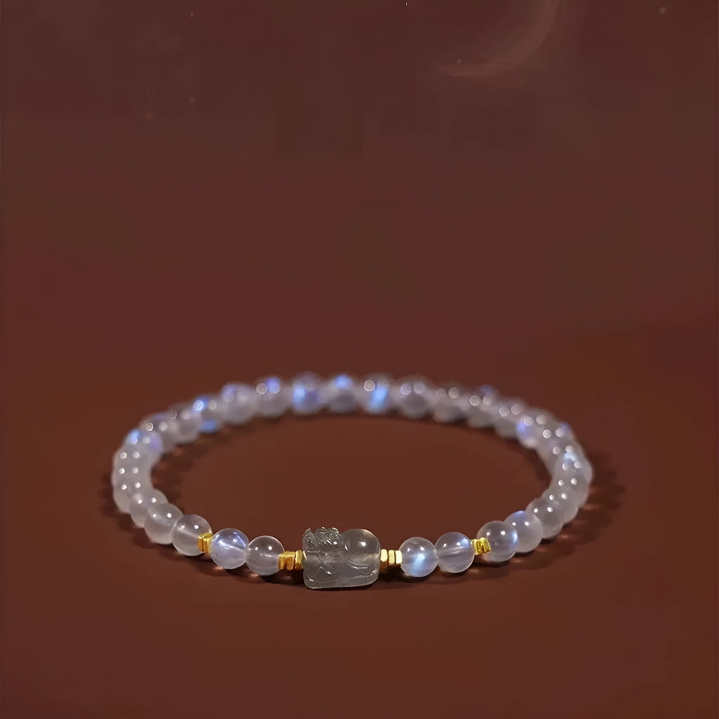 National style moonstone bracelet with animal zodiac design showing blue light fashion effect