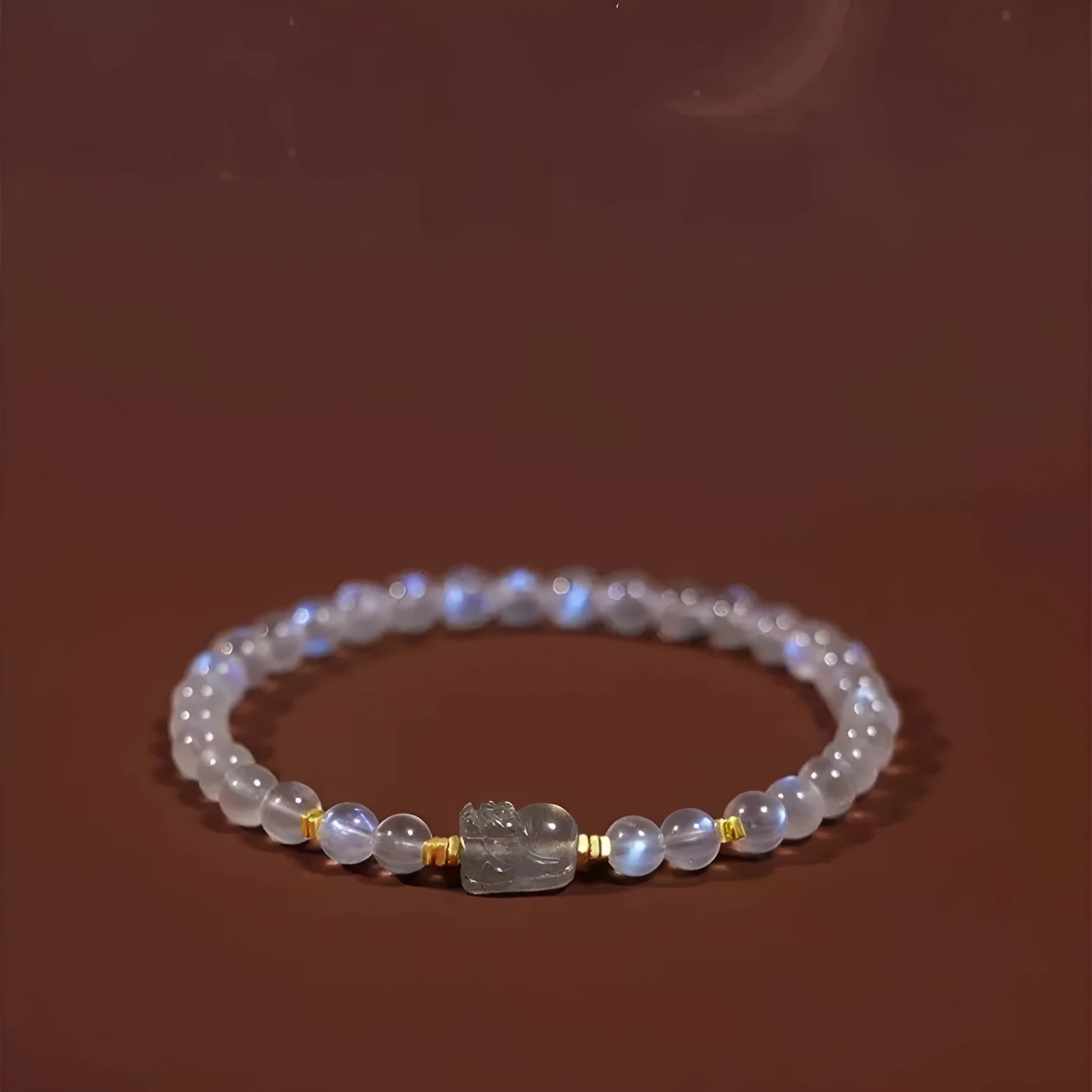 National style moonstone bracelet with animal zodiac design showing blue light fashion effect
