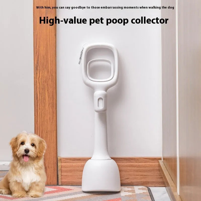White plastic pooper scooper with clip shovel design for dog waste pick-up on grass