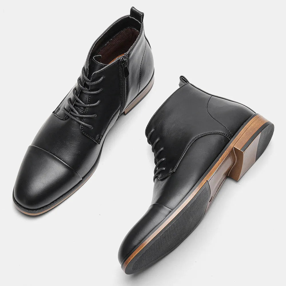 Men's brown Chelsea ankle boots with a side zip, shown on a foot.