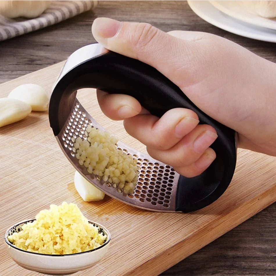 Stainless steel garlic press with non-slip handle for easy mashing