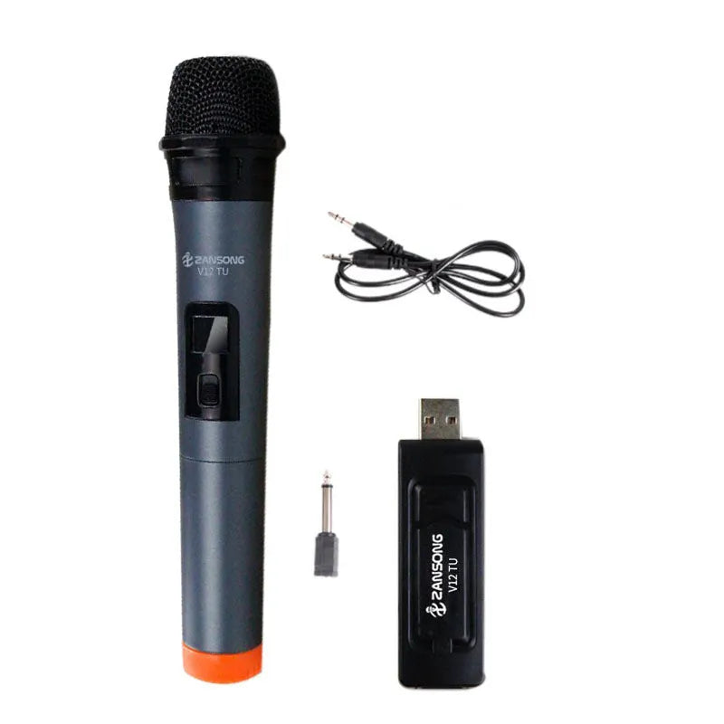 Black dynamic microphone with metal grill, USB receiver, adapter, and audio cable on dark background