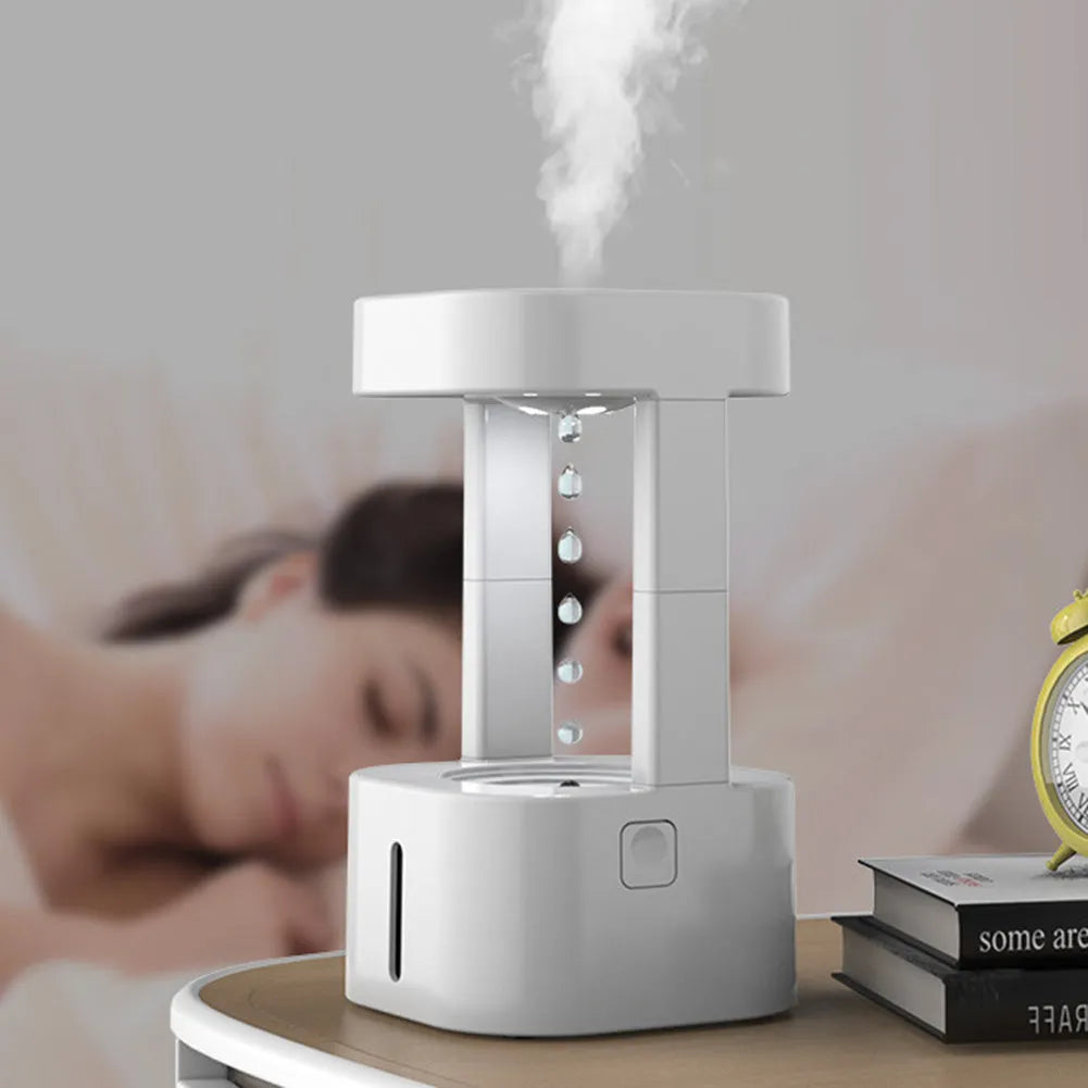 White anti-gravity water drop humidifier with coloured lights and USB cable
