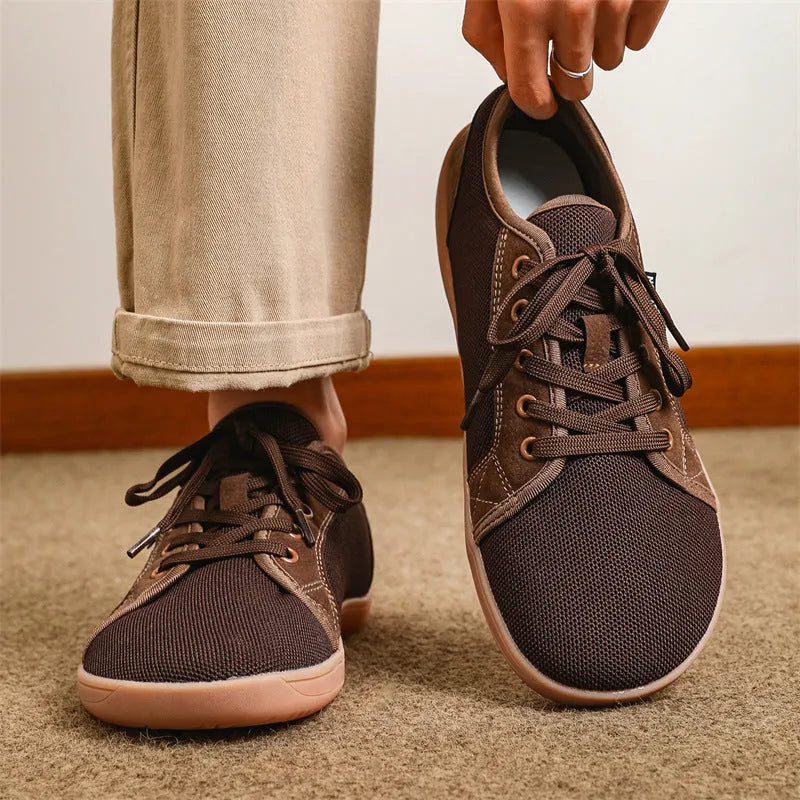 Men's low-top lace-up leisure sneaker with mesh upper, rubber sole, wide toe, flat heel, in black colour