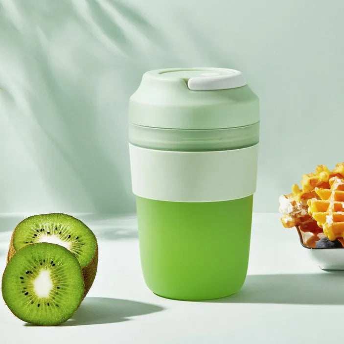 Grape purple portable blender cup with four stainless steel blades and USB charging cable.