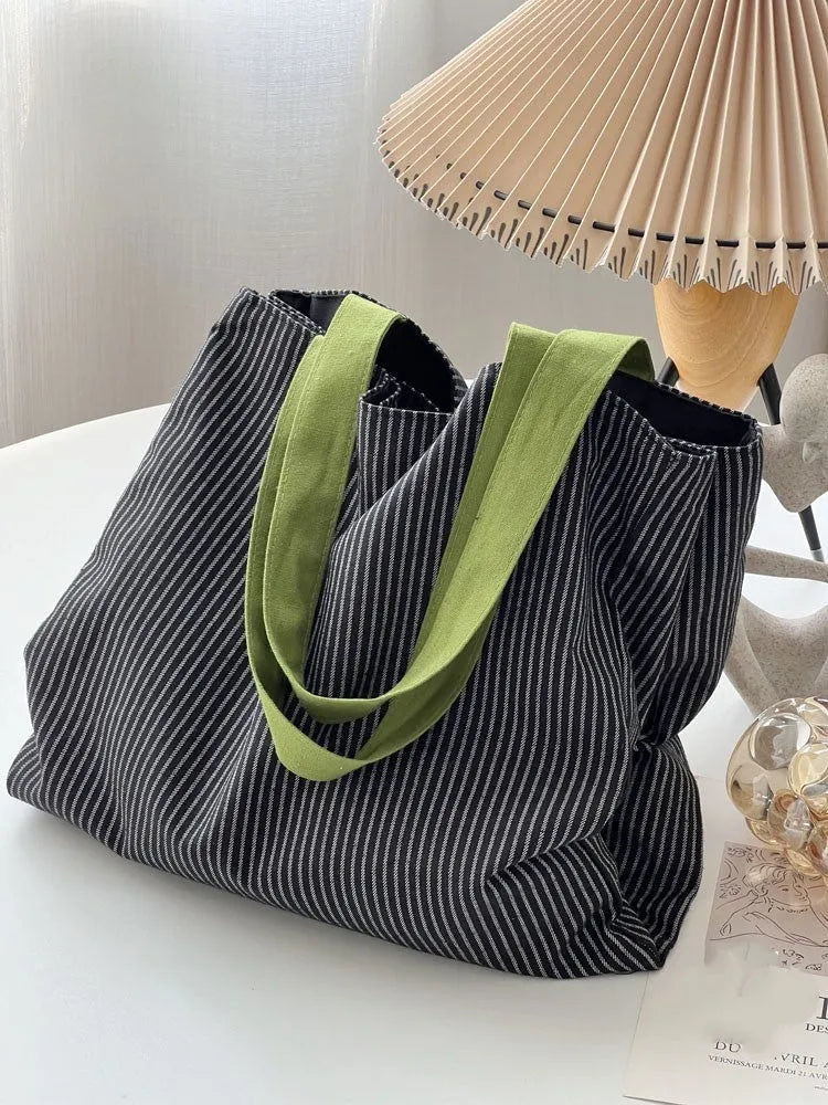 Canvas multi-layer tote shoulder bag showing three colour options: light pink stripes, black and gray plaid, dark gray stripes