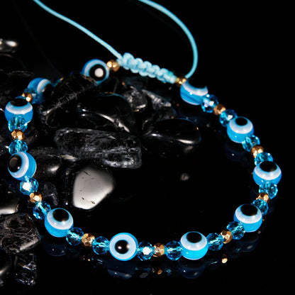 Adjustable crystal bead bracelet with blue eye design on braided rope, fits 15-19cm wrists