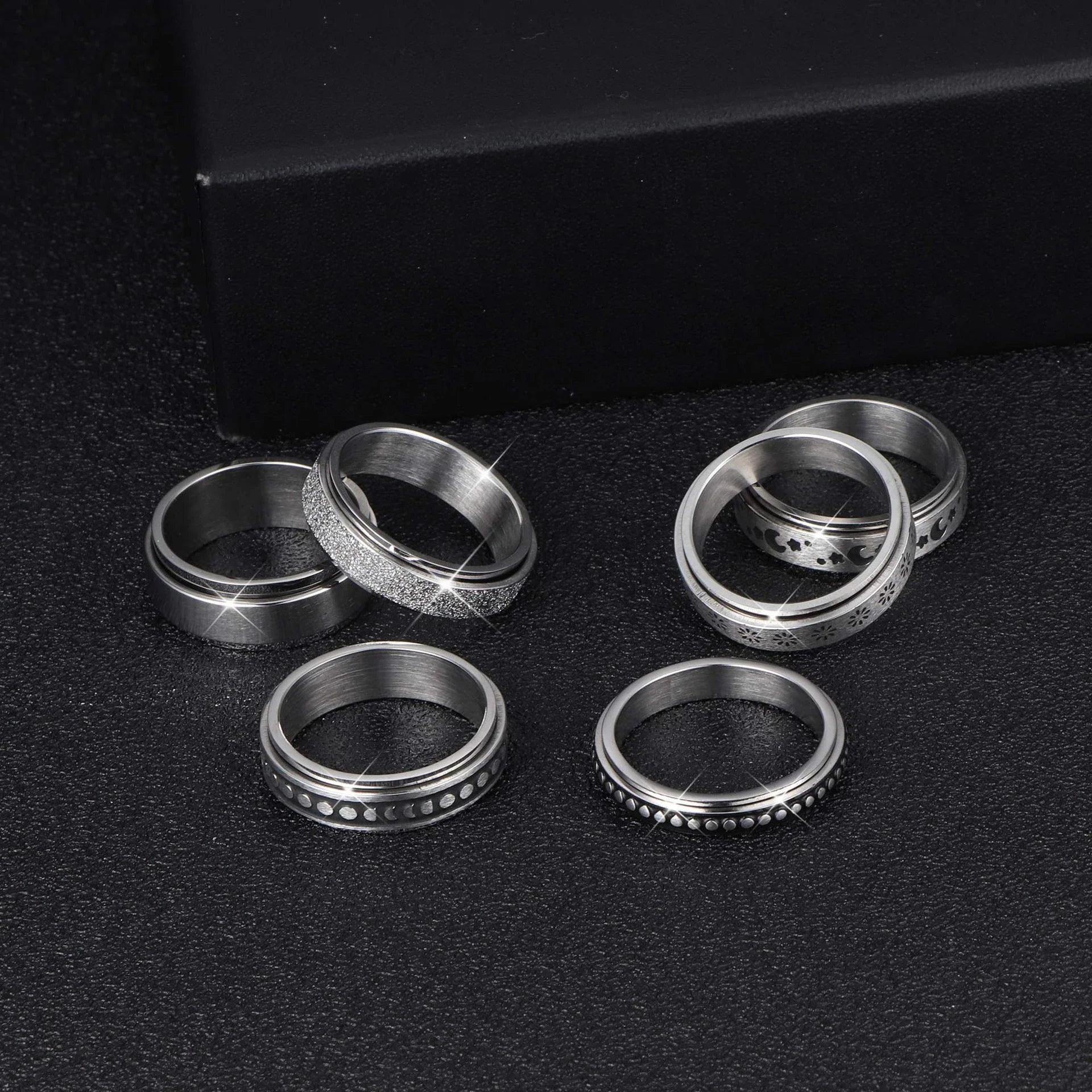 Stainless steel rotatable spinner ring with moon and stars design for stress relief