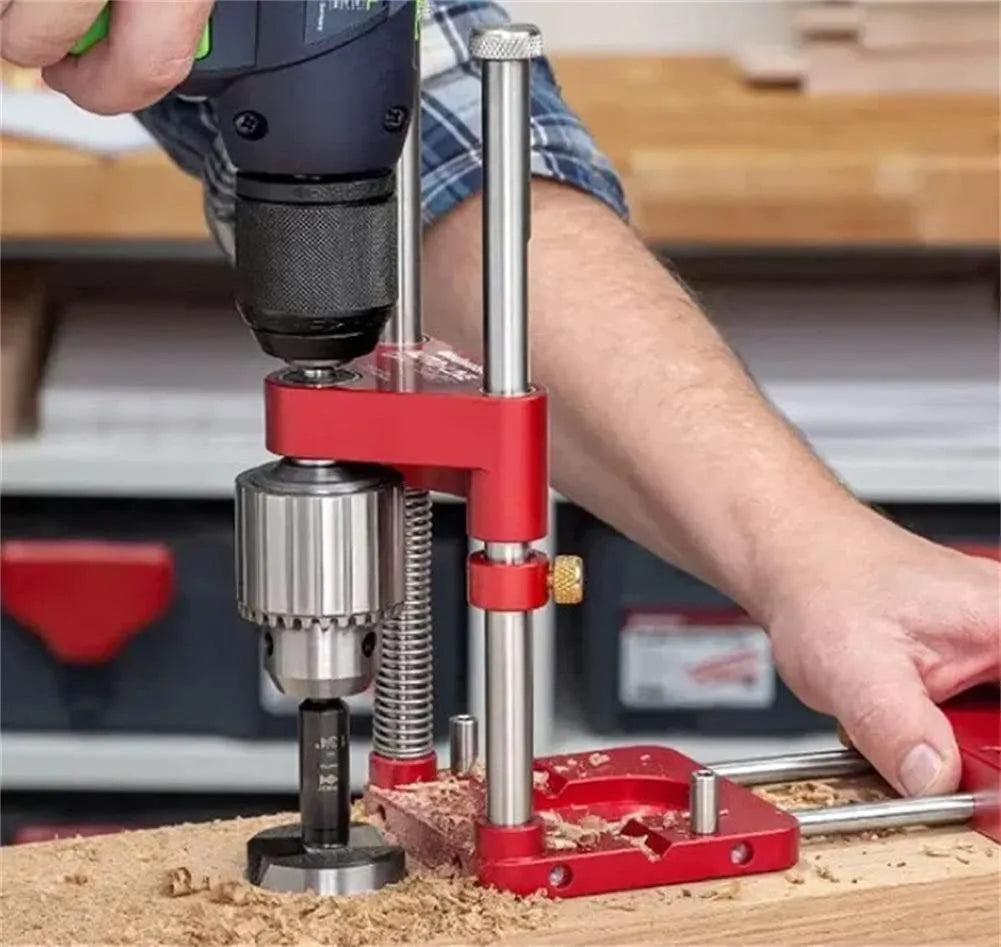Alloy steel woodworking drill locator with red polymer handle on a wooden surface