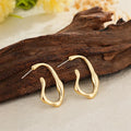 Irregular shaped minimalist drop earrings for women in gold colour metal