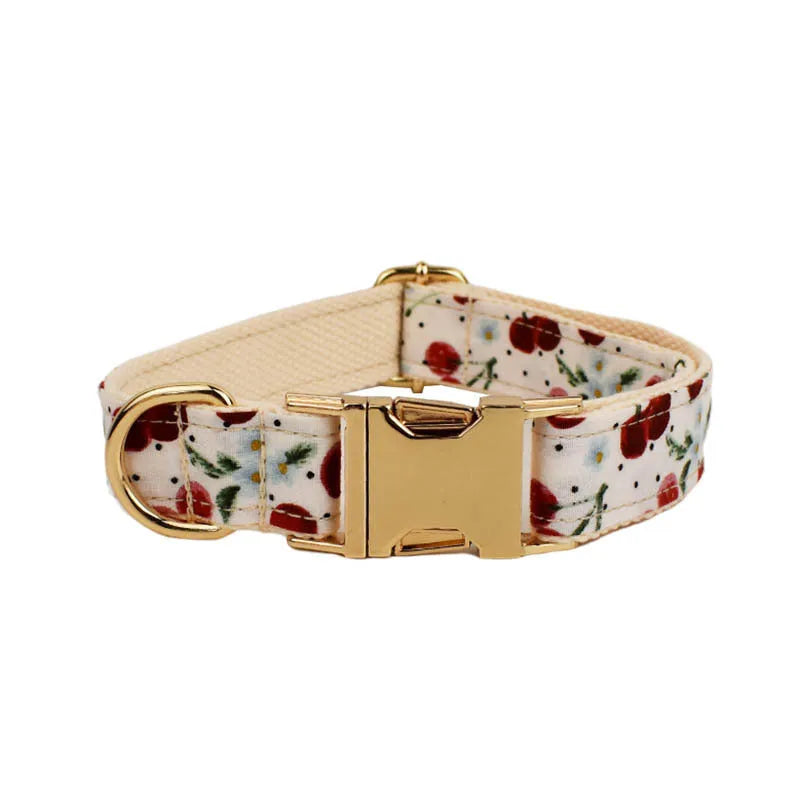 Red cherry printed dog collar and leash set with bow accessory and light gold release buckle