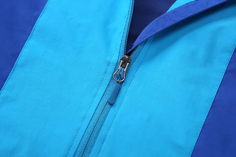 Boy wearing a blue zip-up sanded acetate jacket for autumn