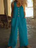 Sleeveless wide leg cotton jumpsuit in peacock green on a hanger
