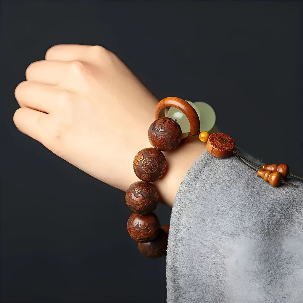 Rosewood bracelet with carved Fu character and amass fortunes motif on 20mm beads