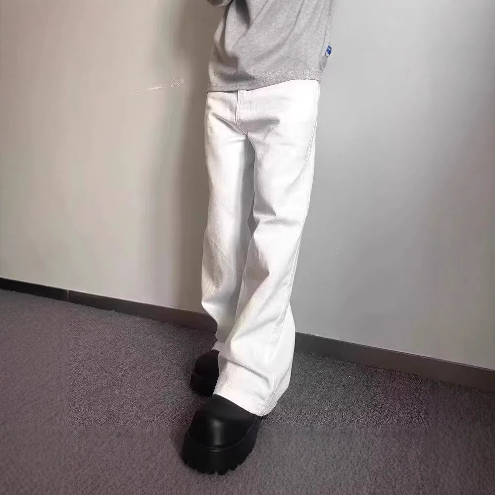 Men's white straight-leg cotton denim jeans on a hanger, showing the mid waist and wide leg opening.