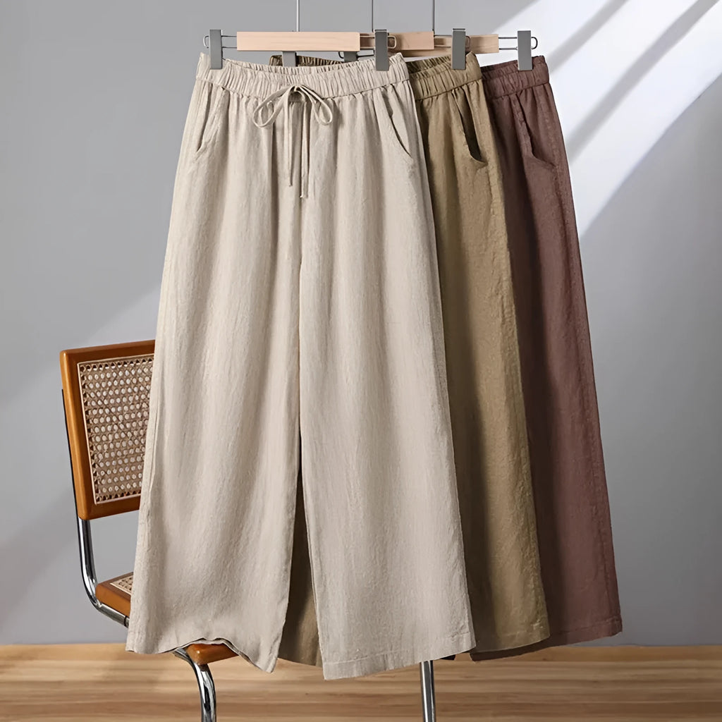 Women's straight-leg casual trousers with elastic drawstring waist in apricot colour.