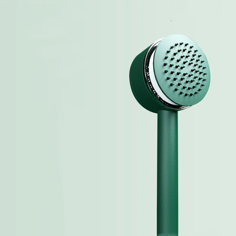 Long handle air cushion comb in green with plastic body for hair styling