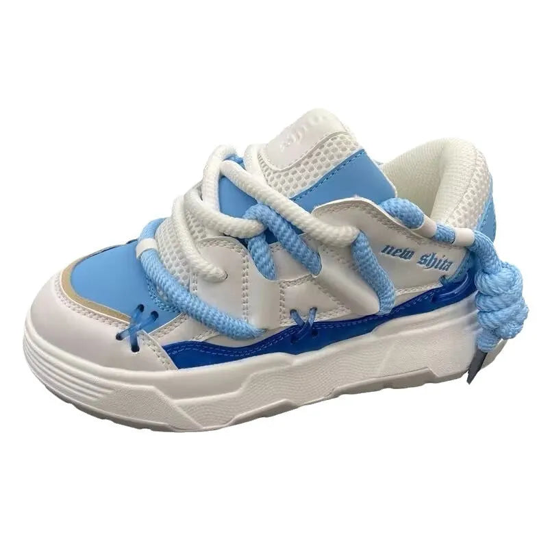 Women's grey retro chunky platform sneakers with thick rubber sole and front lacing