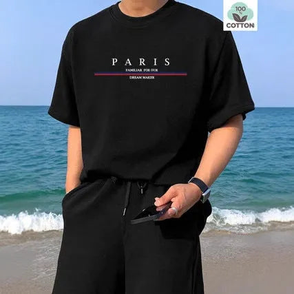 Man modelling a loose-fit, short-sleeved, letter-print T-shirt in pure cotton, shown in apricot colour.