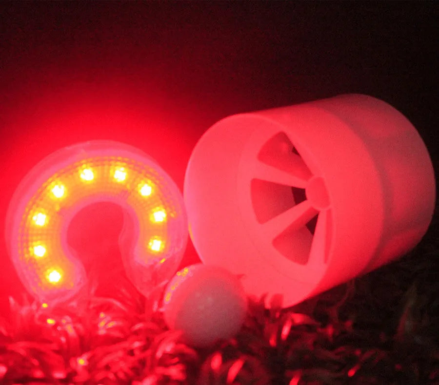 LED ball hole light with transparent shell and screwdriver on golf hole