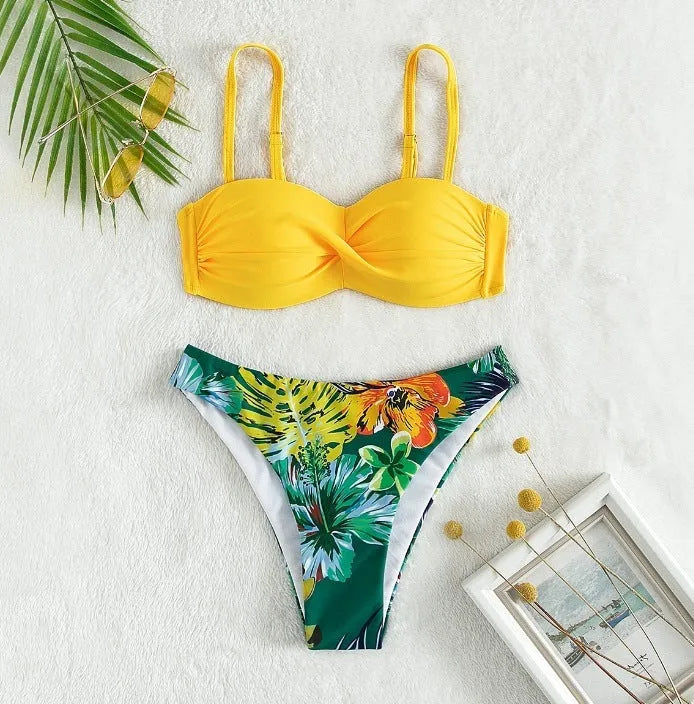 Split push up bikini swimsuit set in green on a mannequin, showing top and briefs style.
