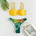 Split push up bikini swimsuit set in green on a mannequin, showing top and briefs style.