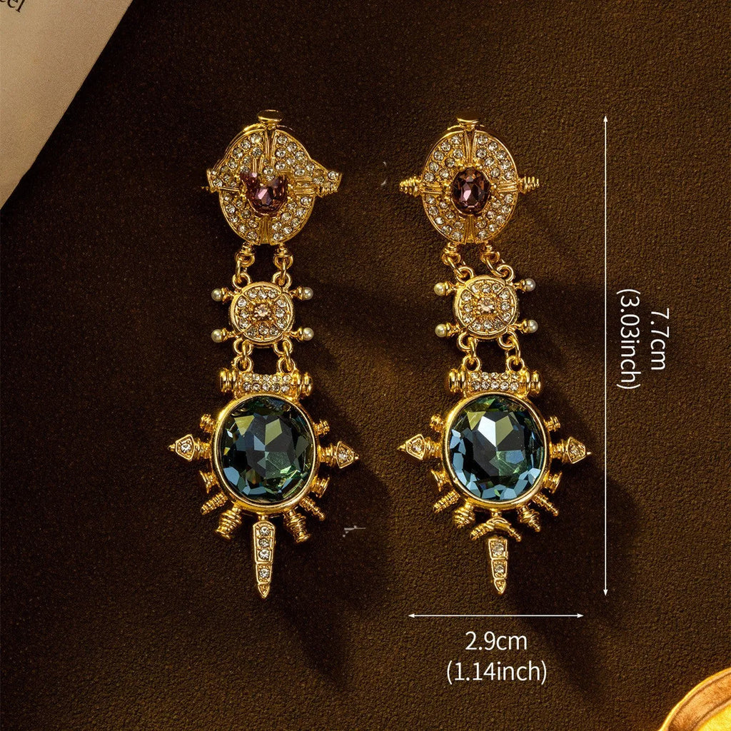 Gold alloy retro geometric round stud earring with diamond finish on white background