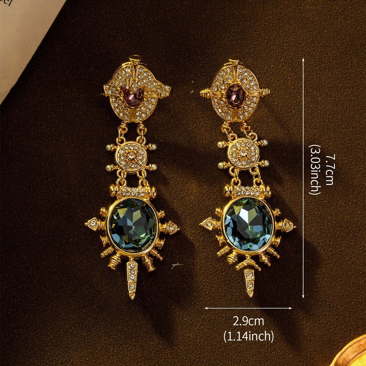Gold alloy retro geometric round stud earring with diamond finish on white background