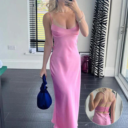 Elegant sleeveless slip maxi dress in pink with backless design and figure-flattering silhouette