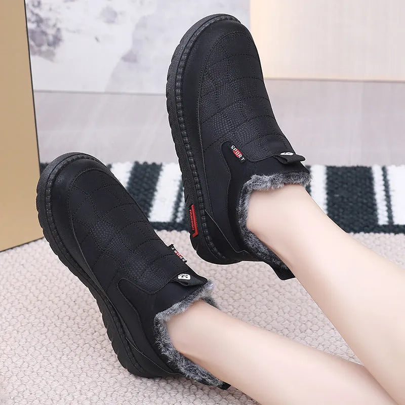 Women's black casual flat boots with round toe and rubber sole