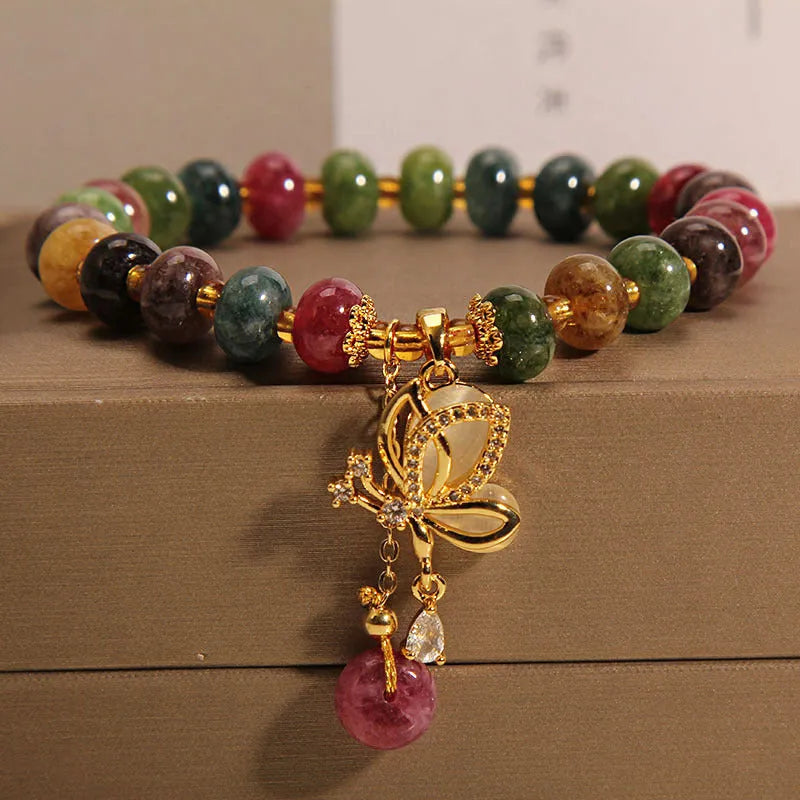 Colourful alloy bracelet for women with a butterfly charm and tourmaline beads on a fresh sweet style band.