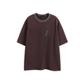 Loose fit purple short-sleeved cotton T-shirt with retro embroidery on a hanger.