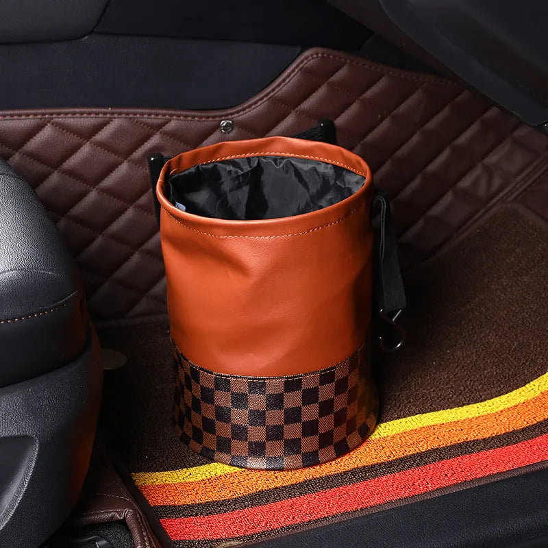 Black retractable leather car rubbish bin with carry handle, shown in folded and expanded states.