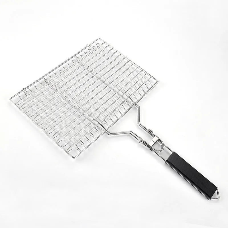 Square stainless steel folding barbecue mesh basket with a grill brush on a grey background.