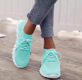 Women's high-cut lace-up sneaker in a choice of colours, showing breathable upper and flat rubber sole.