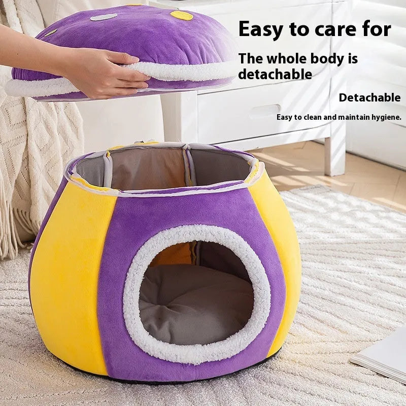 Grey mushroom-shaped plush cat bed with a detachable blanket, shown in a domestic setting.