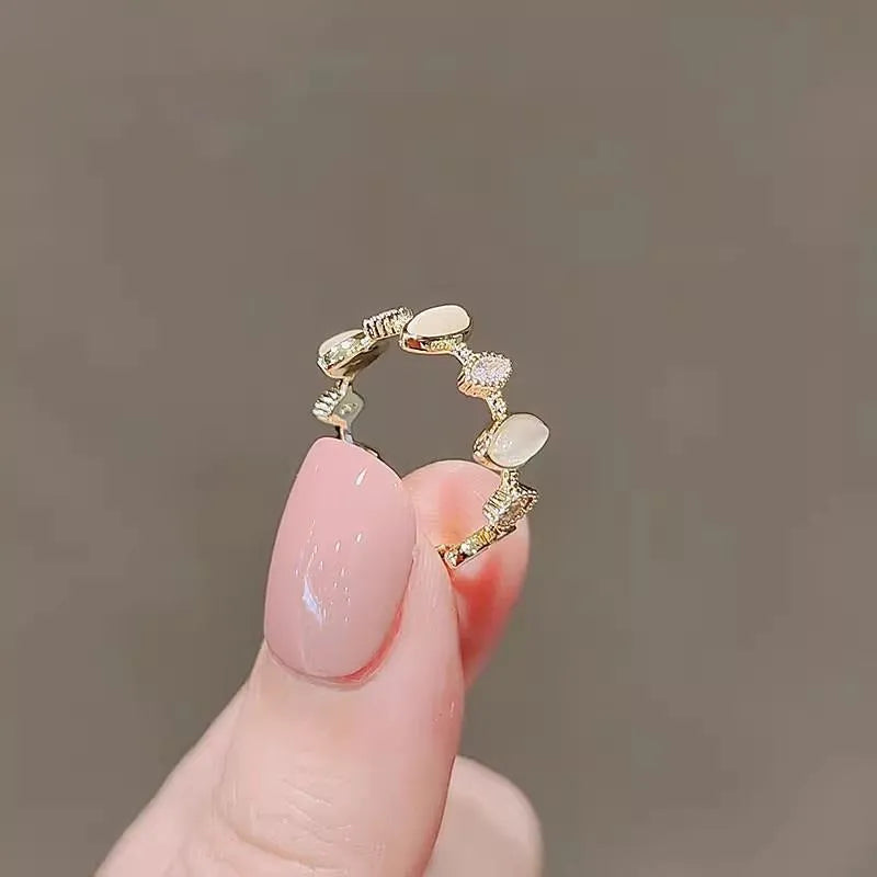 Copper geometric water drop ring for women with electroplated finish on white background