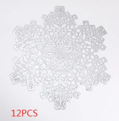 Stylish snowflake-patterned placemats in gold and silver, designed for heat resistance and spill protection on dining tables