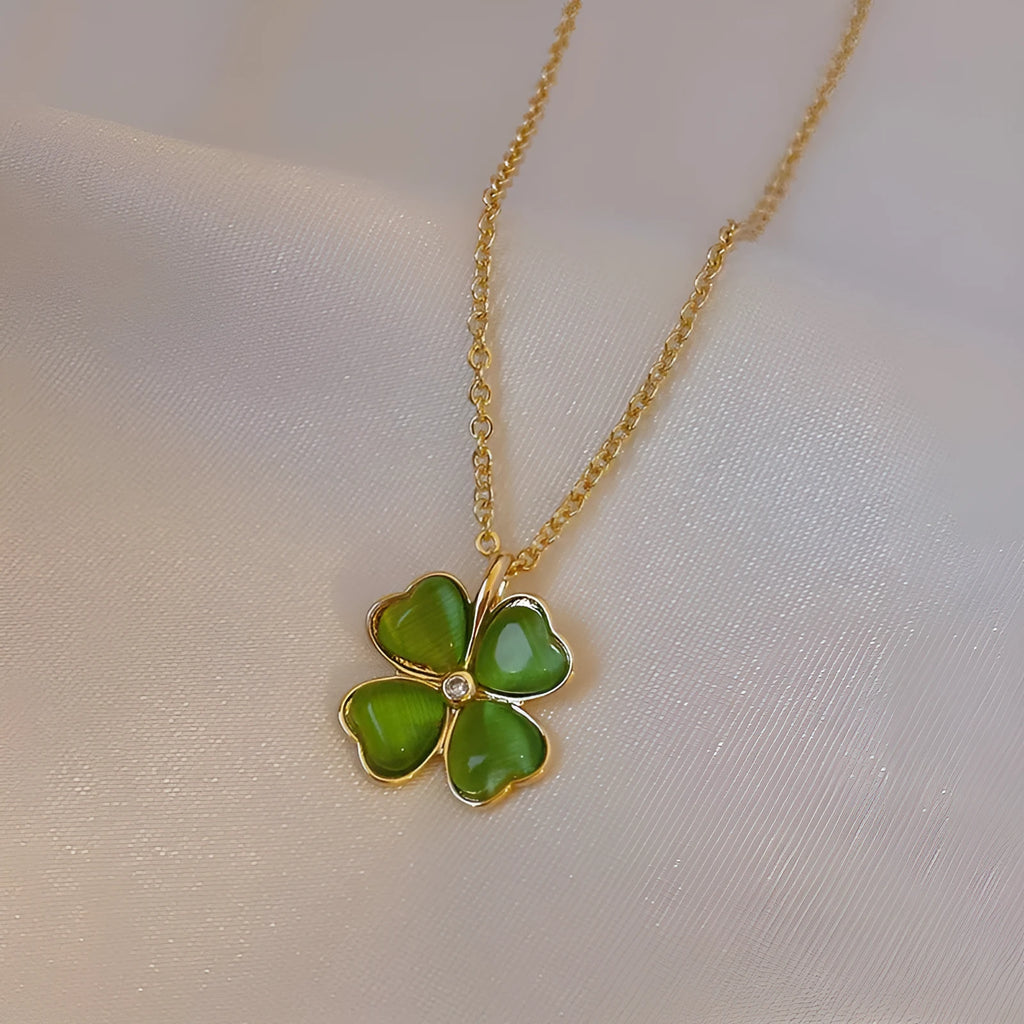 Titanium steel golden clavicle chain with geometric four-leaf flower design on unisex display